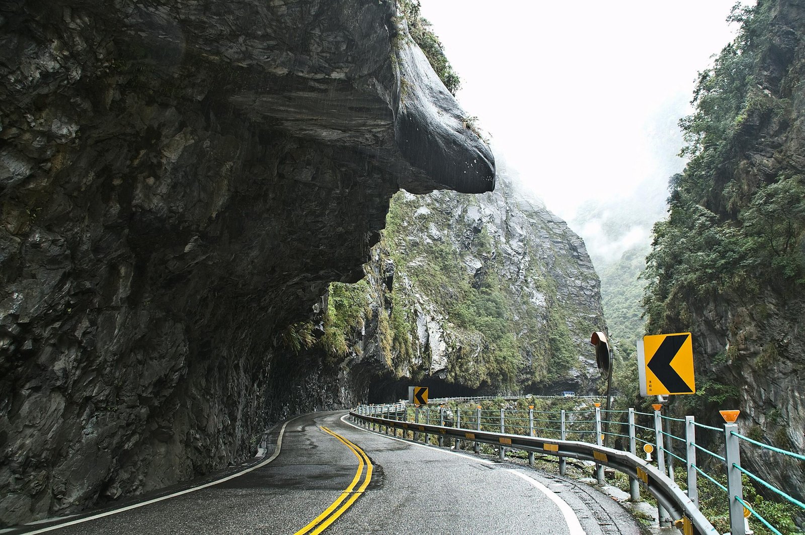 Scenic road through steep cliffs, perfect for adventure travel. Ideal for exploring rocky landscapes.