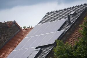 Solar panels installed on a residential rooftop, showcasing eco-friendly renewable energy solutions.