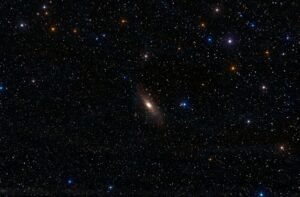 A breathtaking view of the Andromeda Galaxy surrounded by vibrant stars in the night sky.