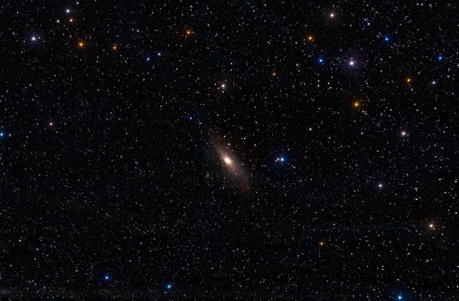 A breathtaking view of the Andromeda Galaxy surrounded by vibrant stars in the night sky.