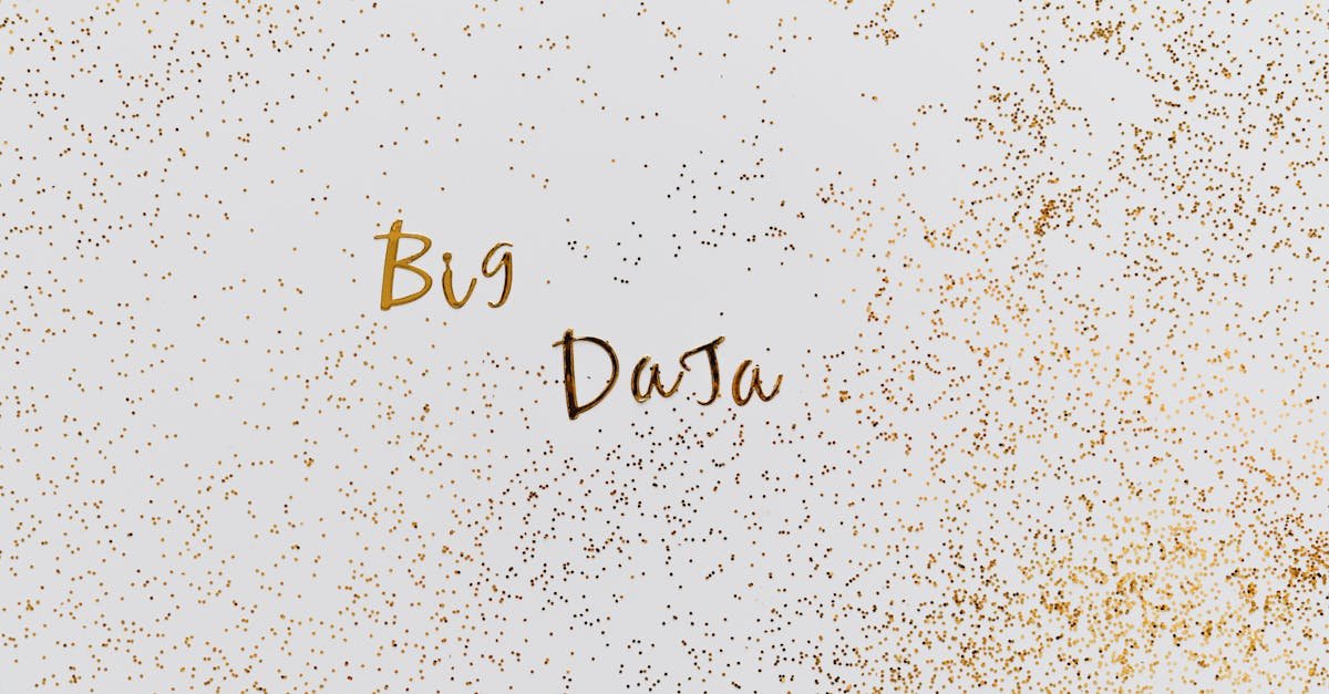 Creative representation of big data with gold particles on white background.