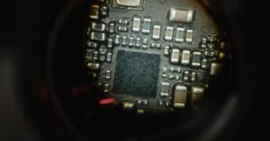 Detailed macro shot of an electronic circuit board showcasing intricate components.