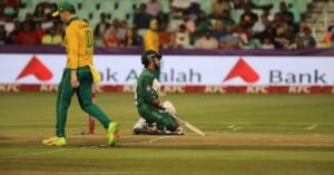 Dynamic cricket scene with players in action on the field during a match.