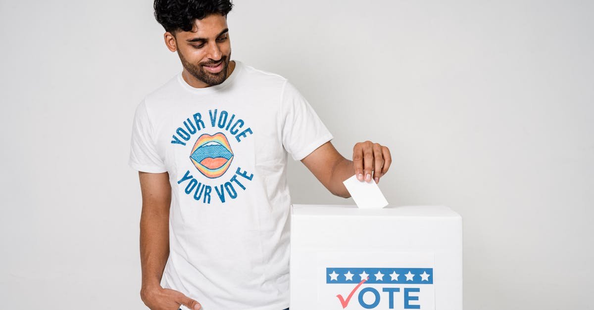 Man casting a vote in an election with a voting ballot box, promoting democratic participation.