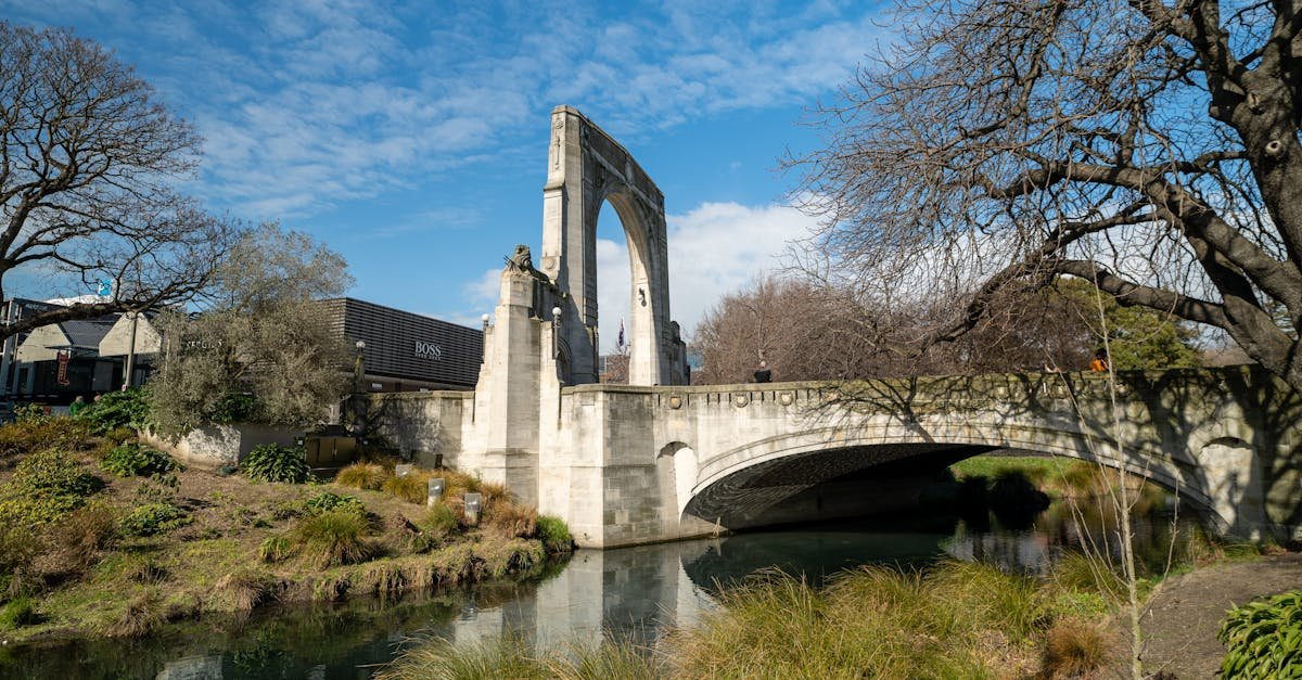 Scenic view of the Bridge of Remembrance in Christchurch, New Zealand, spanning the Avon River.