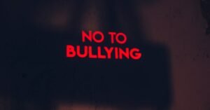 A compelling image with the message 'No to Bullying' in bold red text on a dark background.
